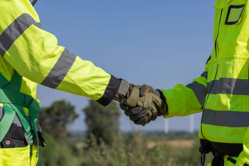 engineer having handshake while work in the wind t 2026 01 11 10 58 03 utc